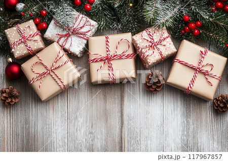 Christmas decoration and gift boxes on wooden background Christmas decoration and gift boxes on wooden background 117967857