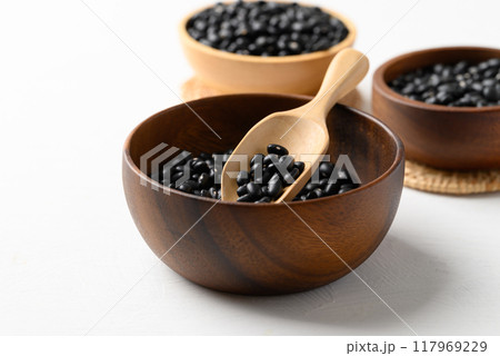 Black bean in wooden bowl with spoon on white background, Food ingredient Black bean in wooden bowl with spoon on white background, Food ingredient 117969229