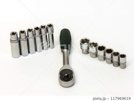 Key ratchet and a set of short and long flare heads. On a white background is Ratchet wrench and union head short and long Key ratchet and a set of short and long flare heads. On a white background is Ratchet wrench and union head short and long 117969619