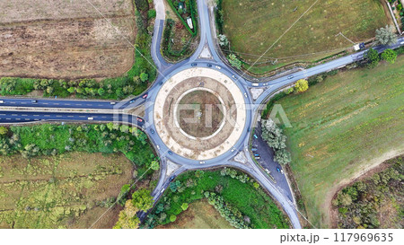 Aerial view of cars driving in a circle in city traffic. High quality 4k footage Aerial view of cars driving in a circle in city traffic. High quality 4k footage 117969635