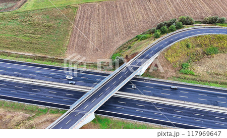 Arial view of Modern transportation with Expressway Road highway Top view. Important infrastructure. Arial view of Modern transportation with Expressway Road highway Top view. Important infrastructure. 117969647