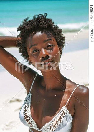 Woman in White Bikini on Beach 117969821