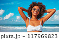 Woman in White Bikini on Beach 117969823