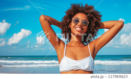 Woman in White Bikini on Beach 117969823