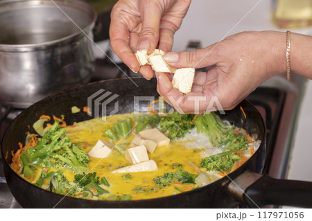 Add processed cheese to puree soup. Cook food. Add processed cheese to puree soup. Cook food. 117971056
