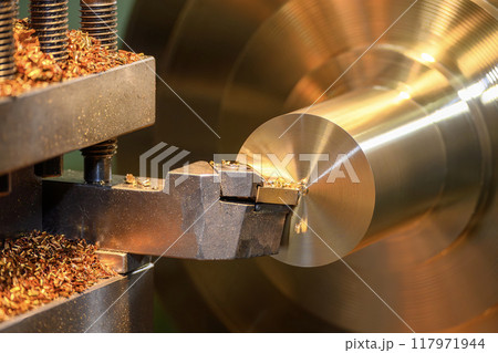 Close up scene the lathe machine finish cut the brass shaft parts. Close up scene the lathe machine finish cut the brass shaft parts. 117971944
