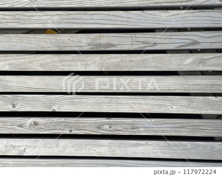 Old grey wooden background, wooden board surface Old grey wooden background, wooden board surface 117972224