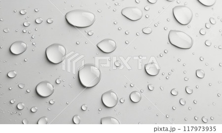 Water droplets scattered on a smooth surface creating a serene and reflective composition 117973935