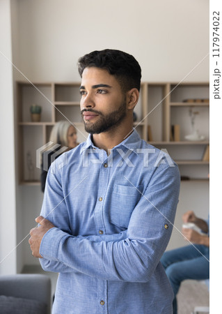 Thoughtful handsome young Arab company manager with hands folded 117974022