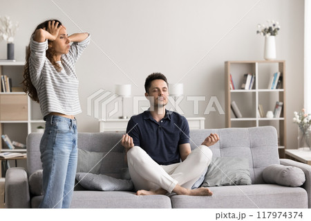 Husband meditate while his wife throws a tantrum 117974374