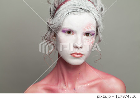 Make-up on female face close-up. Carnival, Halloween or theater actress costume 117974510