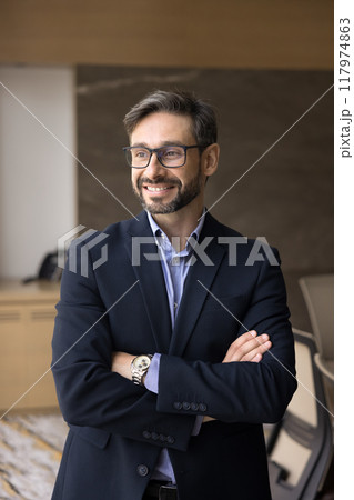 Happy middle aged Latin company CEO man posing in office Happy middle aged Latin company CEO man posing in office 117974863