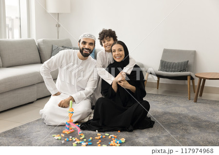 Happy Middle Eastern parents and kid posing for family portrait Happy Middle Eastern parents and kid posing for family portrait 117974968
