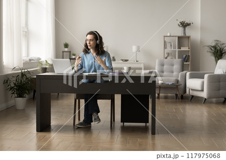 Focused student girl studying on-line using laptop at home Focused student girl studying on-line using laptop at home 117975068