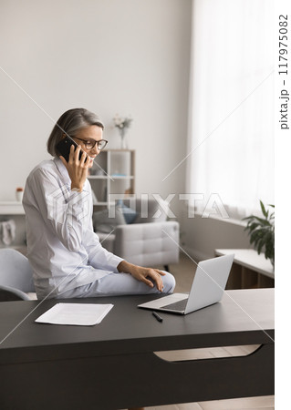 Business woman lead conversation by the phone Business woman lead conversation by the phone 117975082