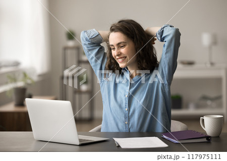Young woman take break, feel satisfied with work results 117975111