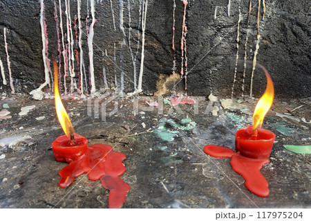 burning candles in a cemetery. Molten wax 117975204