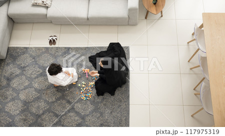 Young Arabic mother and little son wearing Muslim clothes Young Arabic mother and little son wearing Muslim clothes 117975319