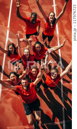 The victorious athletes and their coaches celebrate with elation after achieving an extraordinary milestone, their unified efforts culminating in a historic world record , culture of possibility 117976725