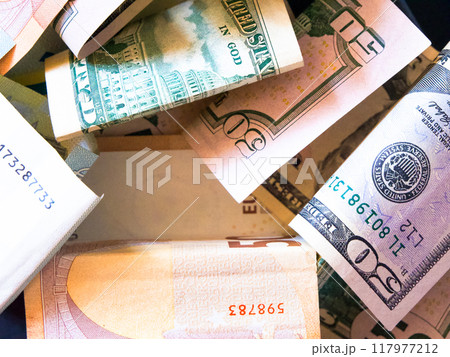 Currency Chaos. Disarray of Euro and Dollar bills. Currency Chaos. Disarray of Euro and Dollar bills. 117977212