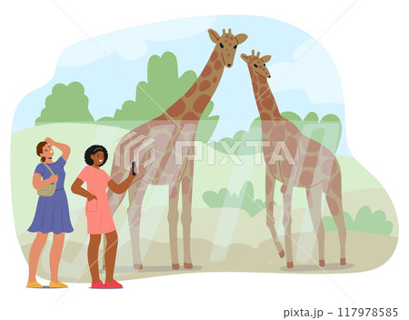 Two Women Are Enjoying A Visit To The Zoo, Captivated By Giraffes In The Enclosure. One Of The Women Is Taking A Photo 117978585