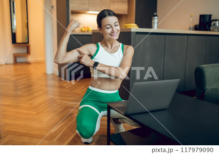 Woman fitness instructor teaching online class working making video blog about sport workout Woman fitness instructor teaching online class working making video blog about sport workout 117979090