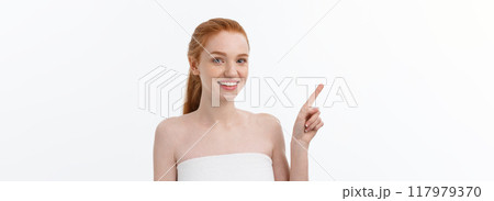 Beauty Skin care portrait of young woman showing copy space by hand. 117979370