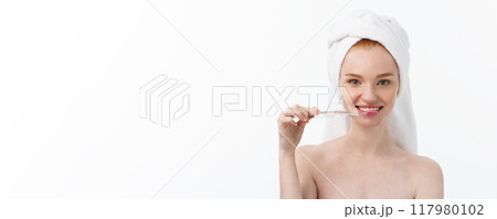 Portrait of young woman with toothbrush on grey background. Portrait of young woman with toothbrush on grey background. 117980102