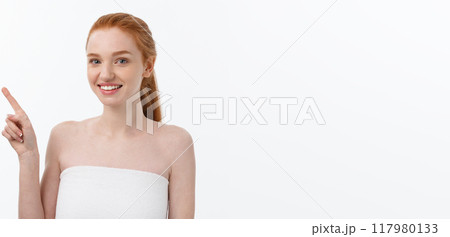 Beauty Skin care portrait of young woman showing copy space by hand. 117980133