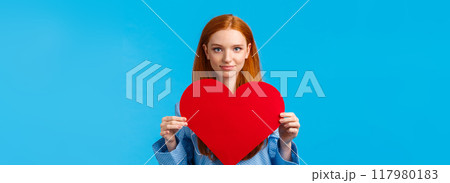 Showing my affection. Valentines day concept. Confident and bold cute redhead woman in nightwear holding huge heart gesture and smiling, expressing love and admiration, confessing Showing my affection. Valentines day concept. Confident and bold cute redhead woman in nightwear holding huge heart gesture and smiling, expressing love and admiration, confessing 117980183