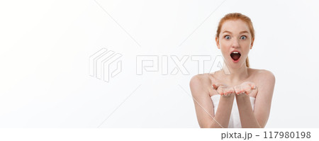Skin care beauty woman showing empty palm with copy space for product. Excited smiling Caucasian female beauty model isolated on white background. 117980198