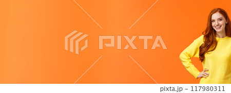 Sounds good, count me in. Waist-up shot cheerful upbeat girl make thumb-up gesture and smiling in approval, like idea, recommend consumer nice product, standing orange background 117980311
