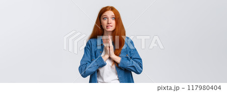 Waist-up portrait nervous redhead female student need help asap, hold hands over chest together in pray, smiling worried and impatient stare camera, pleading, begging favour Waist-up portrait nervous redhead female student need help asap, hold hands over chest together in pray, smiling worried and impatient stare camera, pleading, begging favour 117980404