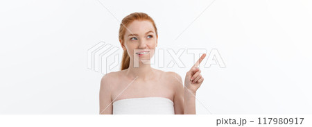 Beauty Skin care portrait of young woman showing copy space by hand. 117980917