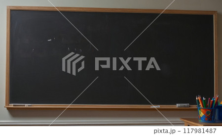 Rectangular framed school board with chalk for writing. 117981487