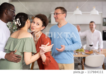 Group of friends greeting each other 117984111