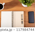 テーブルに置かれたスマホとコーヒーとノート 117984744