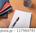 開かれたノートと積まれた本 117984745