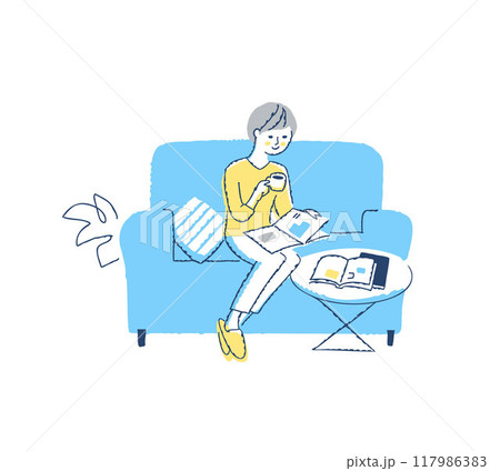 ソファーに座って雑誌を見ながらコーヒを飲んでいる女性 117986383