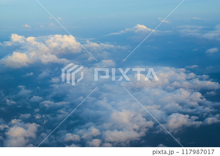 Beautiful blue sky with fluffy clouds creating a dreamlike atmosphere Beautiful blue sky with fluffy clouds creating a dreamlike atmosphere 117987017