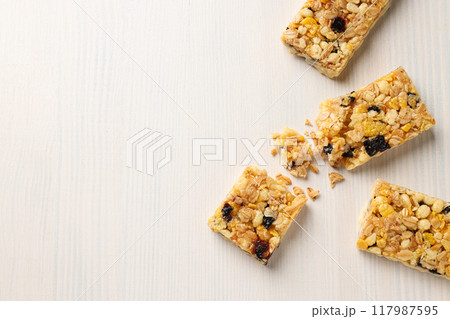 Delicious granola bars on a white background Delicious granola bars on a white background 117987595