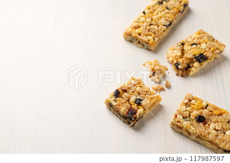 Delicious granola bars on a white background 117987597