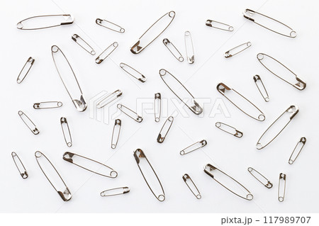 Set of big and small size silver safety pins. 117989707