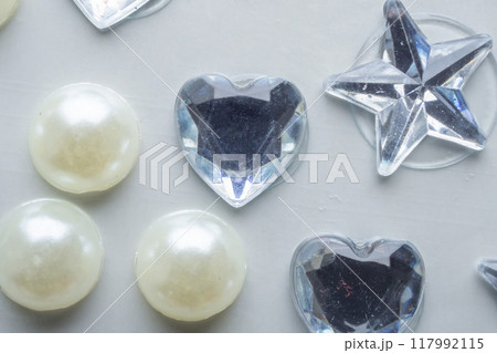 jewelry sticker decorated on white paper background jewelry sticker decorated on white paper background 117992115