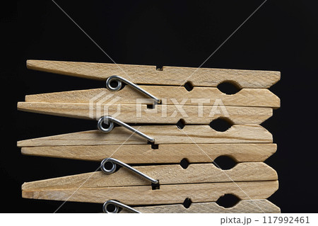 a group of wooden clothespins for drying clothes a group of wooden clothespins for drying clothes 117992461