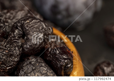 ripe purple plums and dried plums ripe purple plums and dried plums 117992474