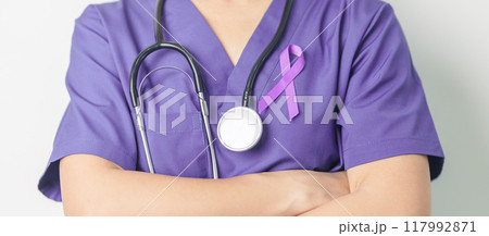 Doctor holding purple Ribbon for Violence, Pancreatic, Esophageal, Testicular cancer, Alzheimer, epilepsy, lupus, Sarcoidosis and Fibromyalgia. Awareness month and World cancer day concept 117992871