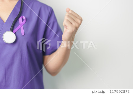 Doctor holding purple Ribbon for Violence, Pancreatic, Esophageal, Testicular cancer, Alzheimer, epilepsy, lupus, Sarcoidosis and Fibromyalgia. Awareness month and World cancer day concept 117992872