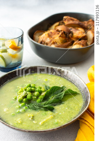 Creamy broccoli and green pea soup, baked chicken with pears and thyme Creamy broccoli and green pea soup, baked chicken with pears and thyme 117993136