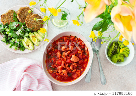 Red soup with beet, vegetables and cauliflower, chickpea cutlets and mixed salad Red soup with beet, vegetables and cauliflower, chickpea cutlets and mixed salad 117993166